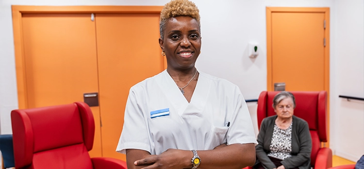 Compassionate nurse assisting elderly residents in nursing home